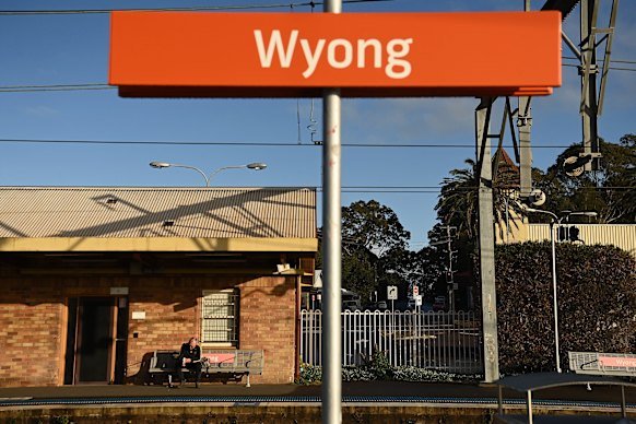 A man waits for a train at Wyong,  one of the few options for public transport on the coast.