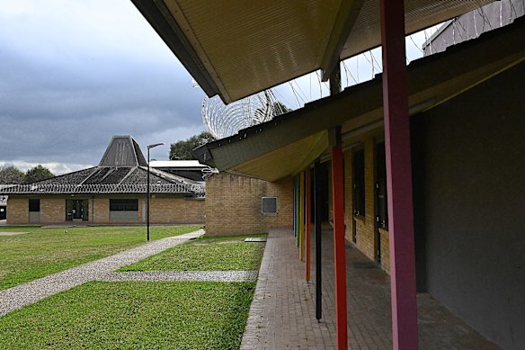 Bright paint and rolls of barbed wire on the buildings at the centre.