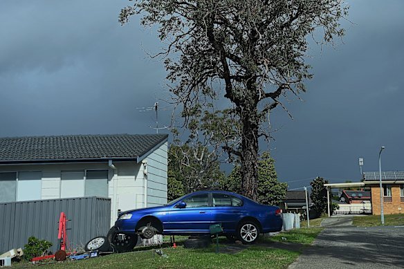 A car up on blocks near homes in Gorokan.