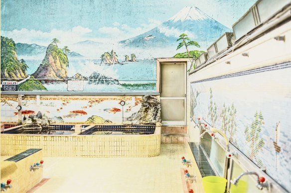 A traditional public onsen in Tokyo, where people wash before dipping in hot baths.