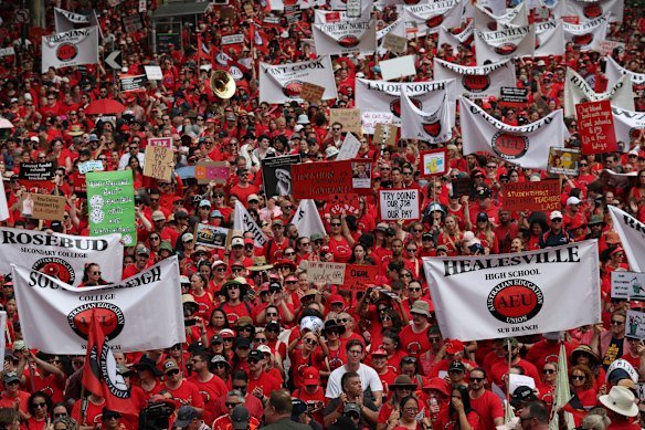 Victorian state school teachers rally at the steps of parliament in March.