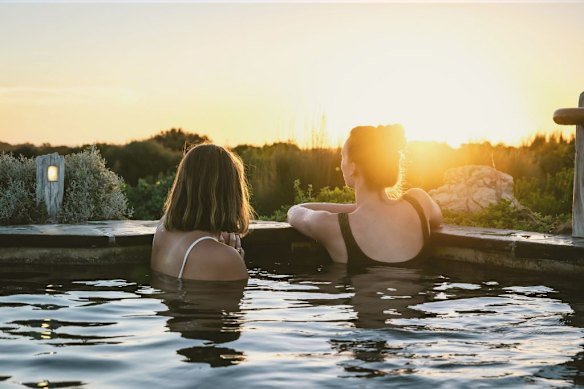 Being out in nature and in good company is part of the benefit of a hot bath such as this one at Peninsula Hot Springs.