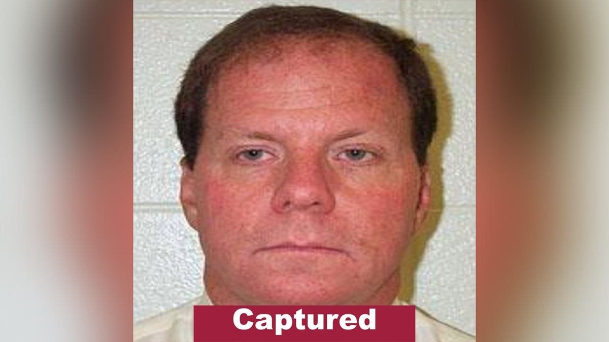 A Rhode Island State Police wanted poster shows Ronald L. Fischer with a red 