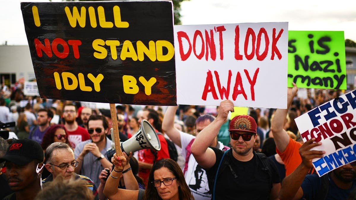 Protesters rally outside an ICE detention facility in Aurora, Colorado