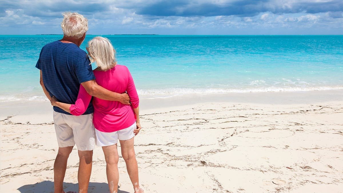 Mature Caucasian senior couple in colourful clothes in the Bahamas