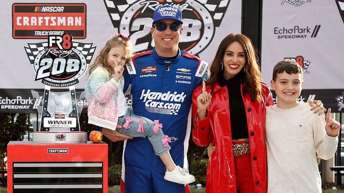 Kyle Busch celebrates with his family in victory lane at Echo Park Speedway.