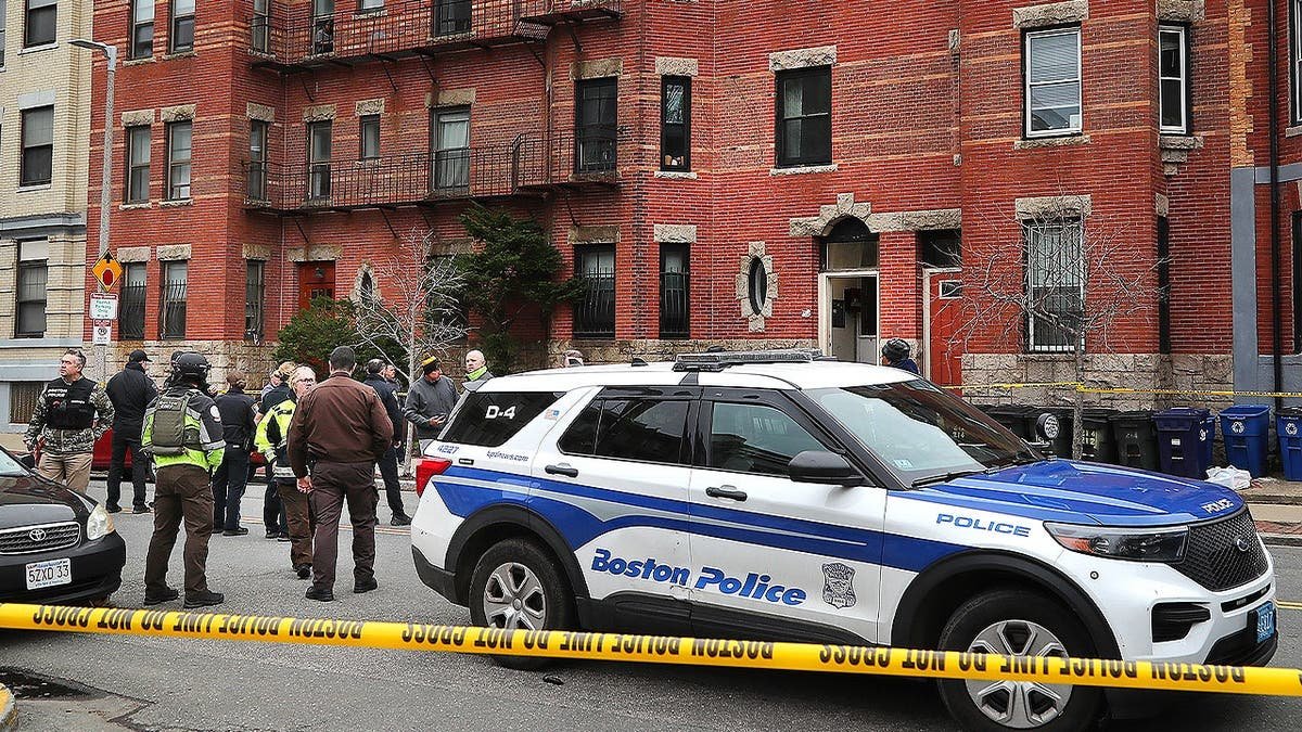 Boston Police and investigators are at a brownstone.