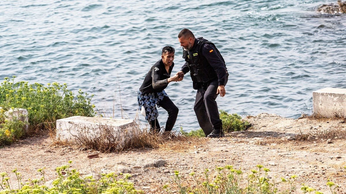 Spanish and Moroccan maritime patrols, supported by Spain's Maritime Rescue service, conduct rescue operations off the southern coast of Ceuta after a sharp increase in migrant arrivals to the Spanish enclave in North Africa. Nearly 2,000 migrants have reached Ceuta over the past two weeks, most by swimming around the Tarajal breakwater separating Spain from Morocco. The arrivals include hundreds of unaccompanied minors, prompting local authorities to warn that child protection facilities have been overwhelmed as rescue and border surveillance operations continue.