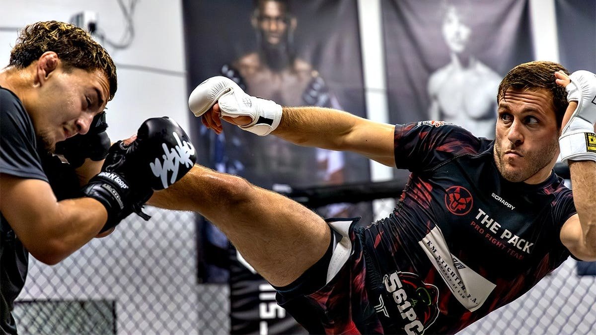 MMA fighter Dustin Lampros kicks