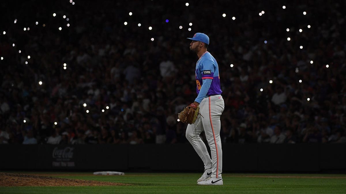 Gabriel Hughes pitches on the mound at Coors Field.