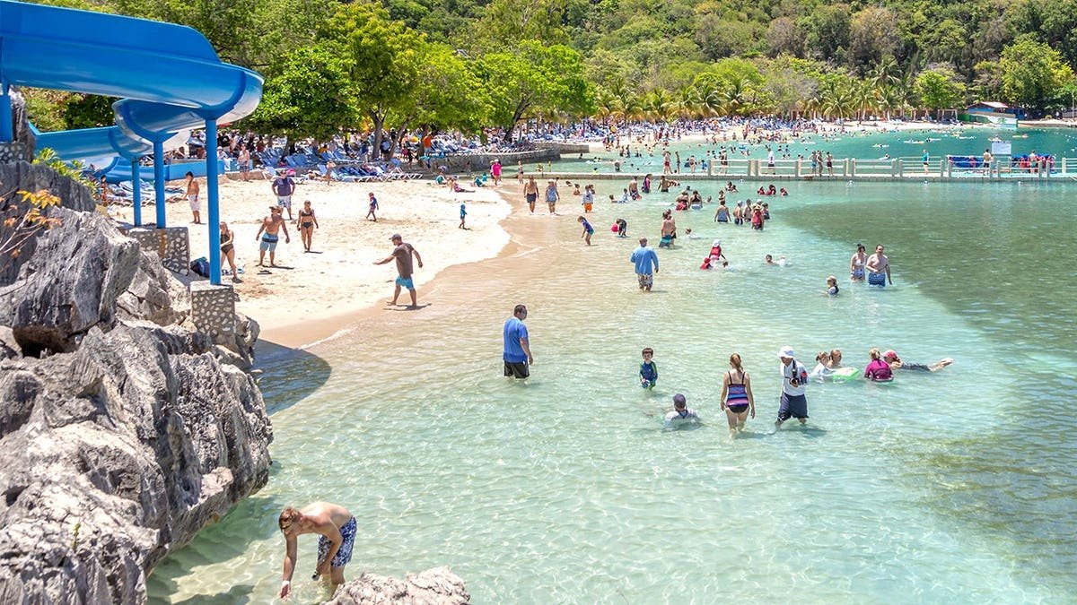 Beachgoers in water in Labadee