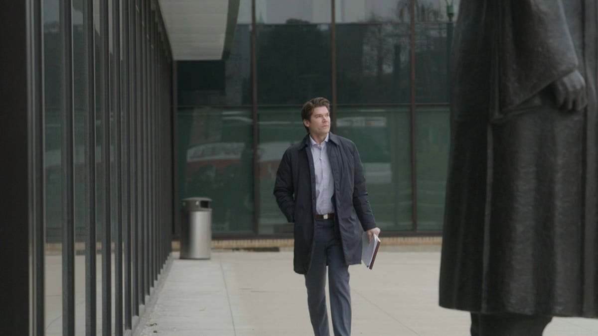 Chris Pixley walking outside his office talking about the Scott Peterson case.