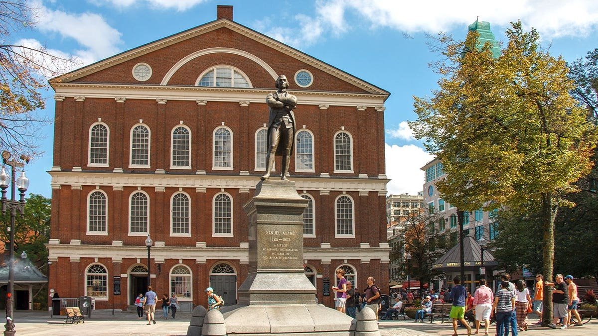 Tourists standing outside Faneuil Hall