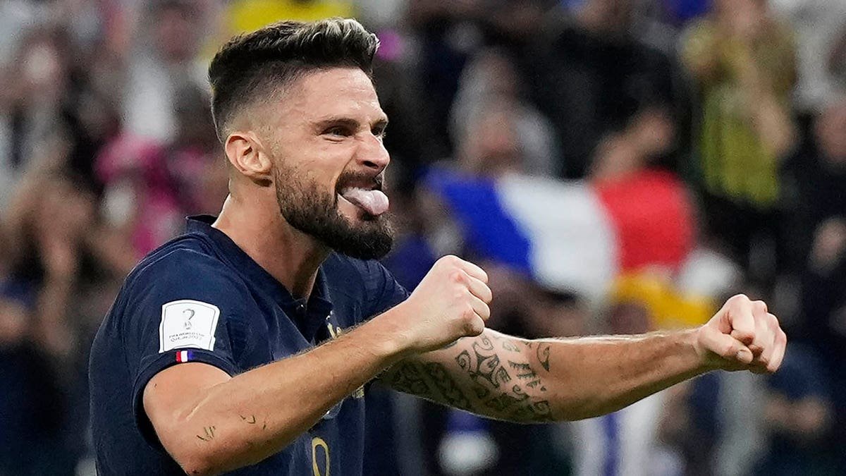 Olivier Giroud celebrates Kylian Mbappe's goal