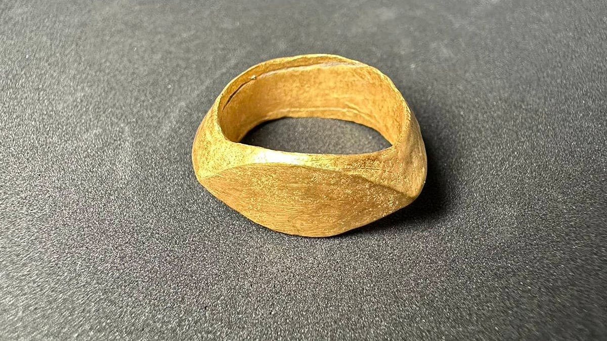 Close-up of gold ring without inscription