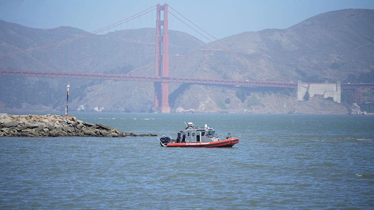 San Francisco Fire Department and Coast Guard crews search San Francisco Bay near Alcatraz after boat capsize