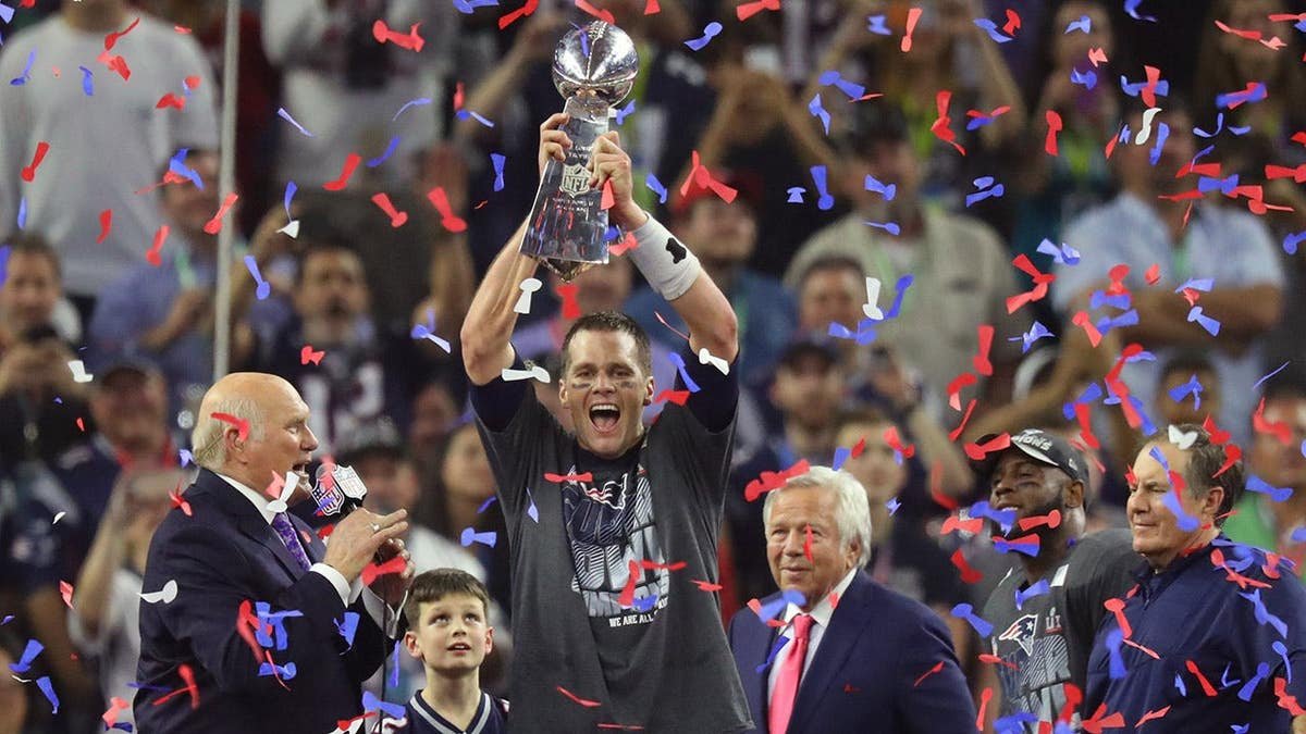 Tom Brady hoists the Vince Lombardi Trophy