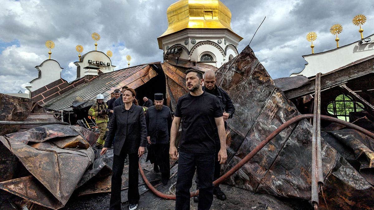 Ukraine's President Volodymyr Zelenskyy and Ukrainian Prime Minister Yulia Svyrydenko walking