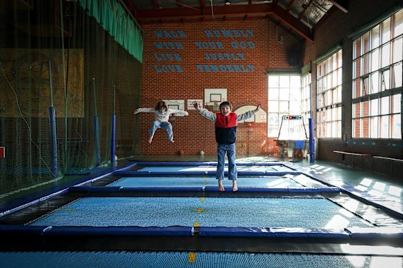 Jesse and Henrietta Longley bounce on the trampolines at the Don Bosco Youth Centre which is being sold by the Salesians. 