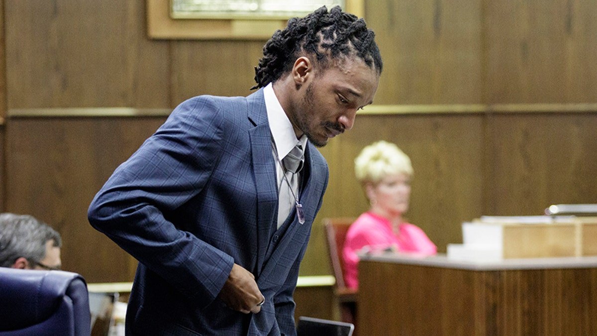 Woodmore bus driver Johnthony Walker walks back to his seat after giving a statement during his sentencing hearing in Judge Don Poole's courtroom at the Chattanooga-Hamilton County Courts Building, Tuesday, April 24, 2018, in Chattanooga, Tenn. Walker, who was at the wheel in a wreck that killed six children, was sentenced to four years in prison for criminally negligent homicide (Doug Strickland/Chattanooga Times Free Press via AP)