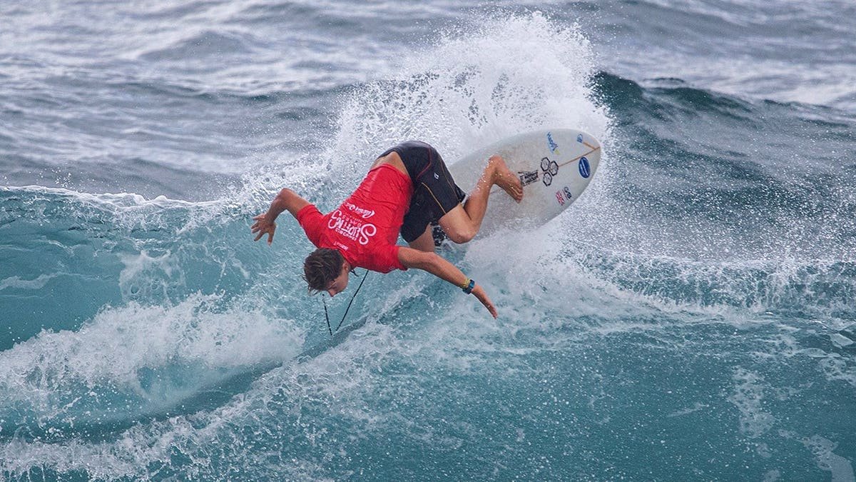 Arran Strong competes in surfing waves during the ISA World Surfing Games off La Marginal beach.