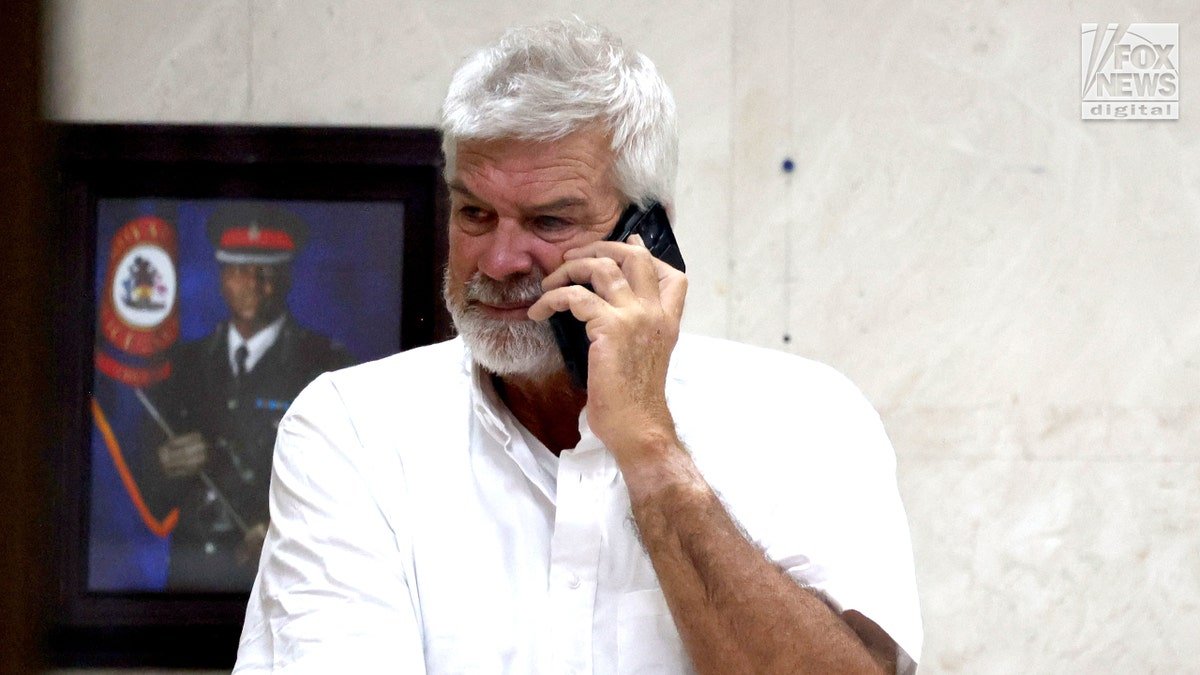 Brian Hooker leaves police station in The Bahamas, with lawyer
