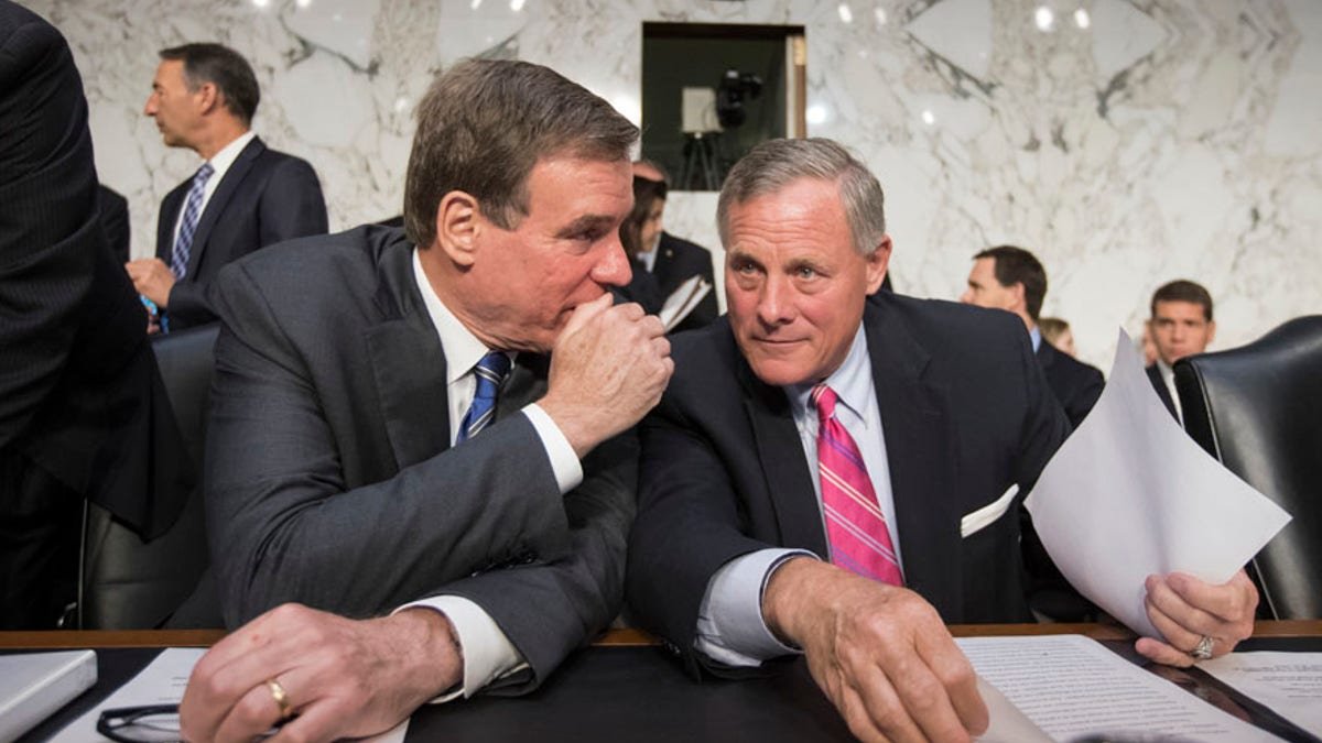 Senate Intelligence Committee Chairman Sen. Richard Burr, R-N.C., right, and committee Vice Chairman Sen, Mark Warner, D-Va. confer on Capitol Hill in Washington, Wednesday, June 28, 2017, as the panel conducts a hearing on Russian intervention in European elections in light of revelations by American intelligence agencies that blame Russia for meddling in the 2016 U.S. election. (AP Photo/J. Scott Applewhite)