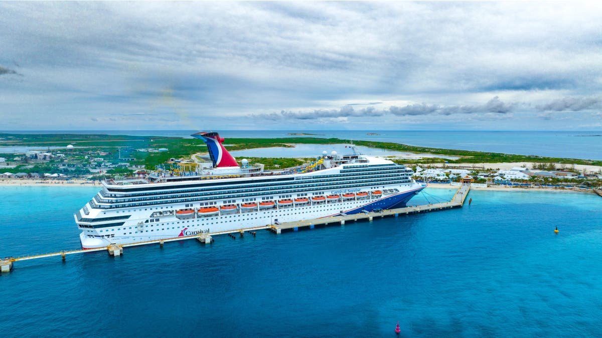 Carnival Sunrise cruise ship sits in water near Grand Turk.