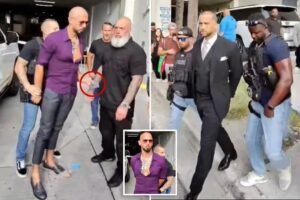 Andrew Tate arrest video shows moment he tried to give phone to bodyguard as he’s cuffed by US Marshals Andrew Tate arrest video shows moment he tried to give phone to bodyguard as he’s cuffed by US Marshals