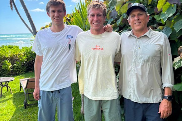 Charlie Verco (middle) with his brother George and father Jamie. Jamie and George will be supporting Charlie when he competes on Monday in the world championship paddleboarding competition. 