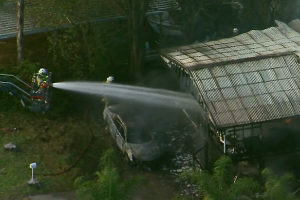 Firefighters battle the blaze in Kingston, south of Brisbane.