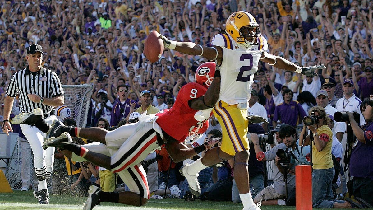 Demetrius Byrd of Louisiana State scores a touchdown as Georgia defenders Reshad Jones and Vance Cuff defend.