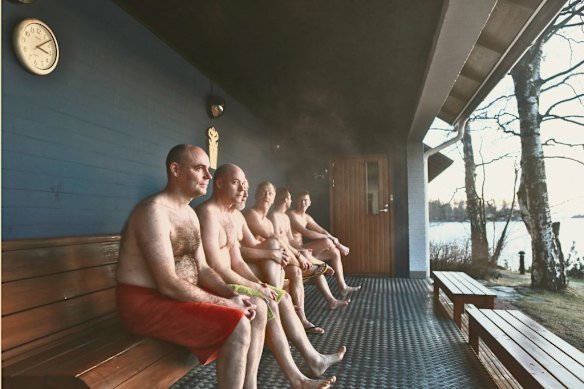 Members of the Finnish Sauna Society, founded in 1937, outside a sauna near Helsinki in 2016. The club has about 4000 members (women and men) today.