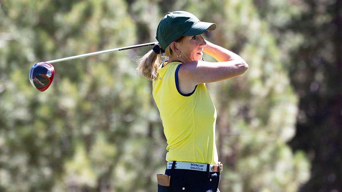 Cathy Engelbert tees off on a golf course in Stateline, Nevada.