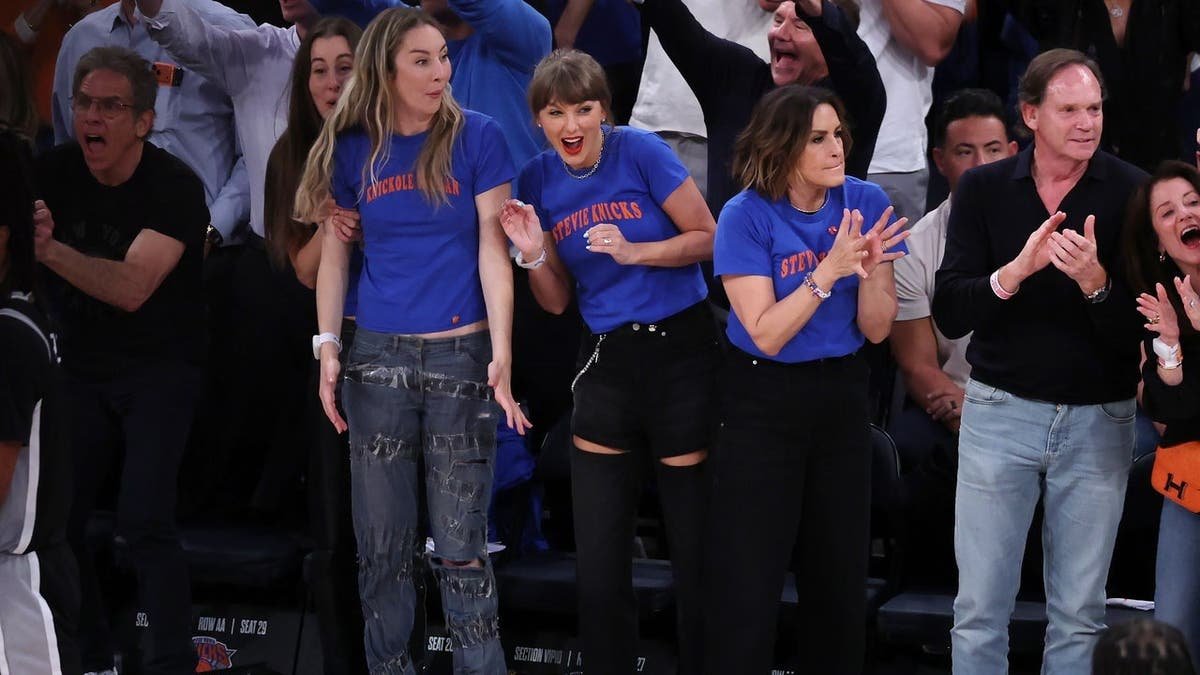 Este Haim, Taylor Swift, and Mariska Hargitay reacting during NBA Finals game at Madison Square Garden