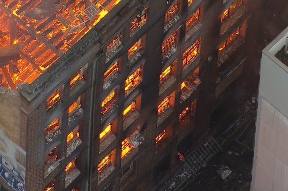 The former Henderson hat factory building engulfed in flames in 2023.