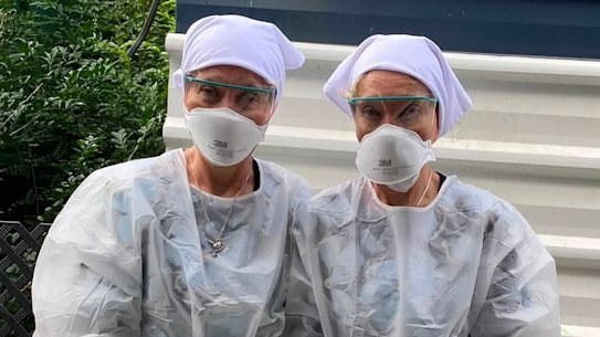 Twinnies Pelican and Seabird Rescue owners Bridgette and Paula Powers wearing PPE to handle a sick bird.