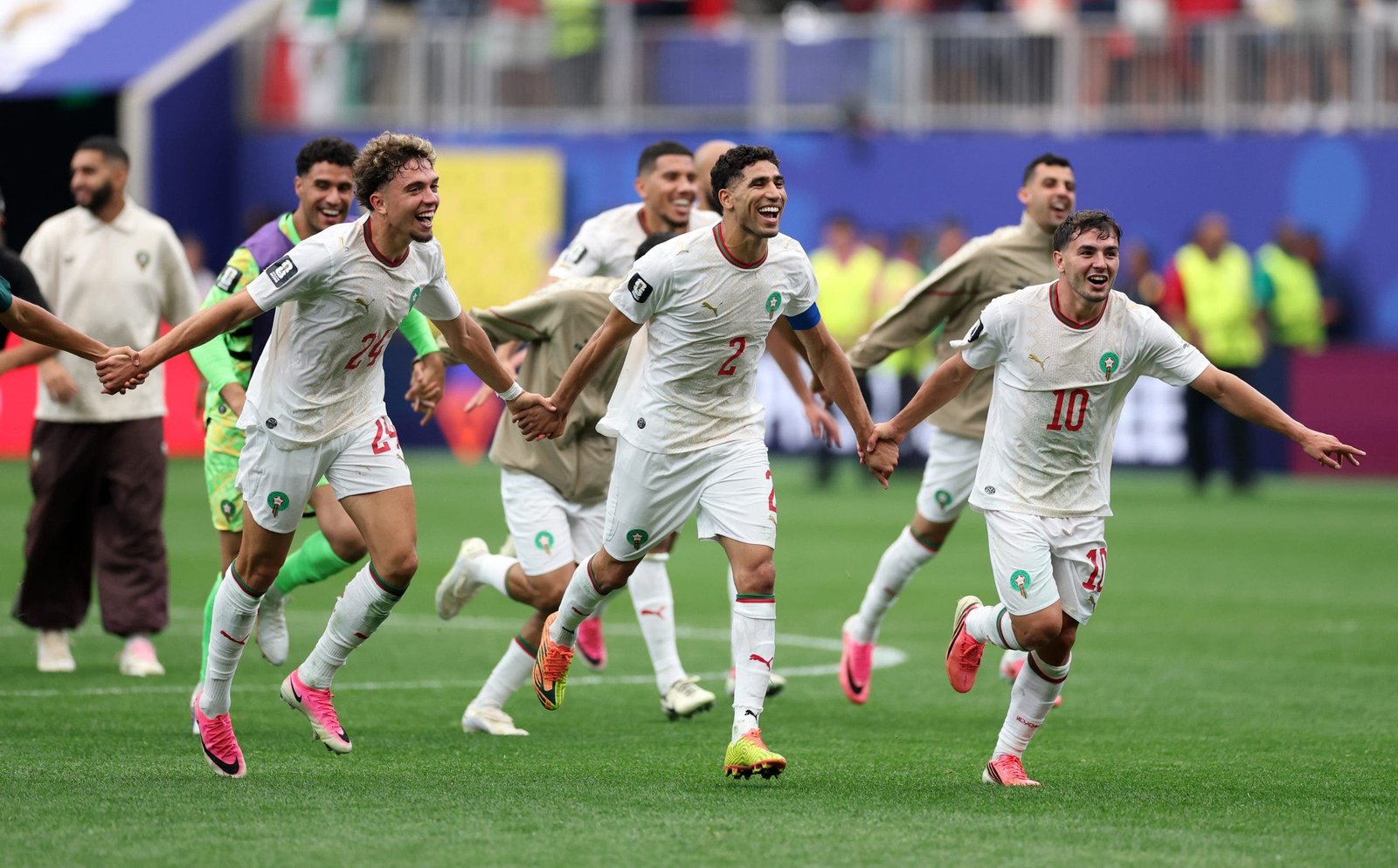 Neil El Aynaoui, Achraf Hakimi and Brahim Diaz celebrate vs. Canada (Photo by Kevin C. Cox/Getty Images).