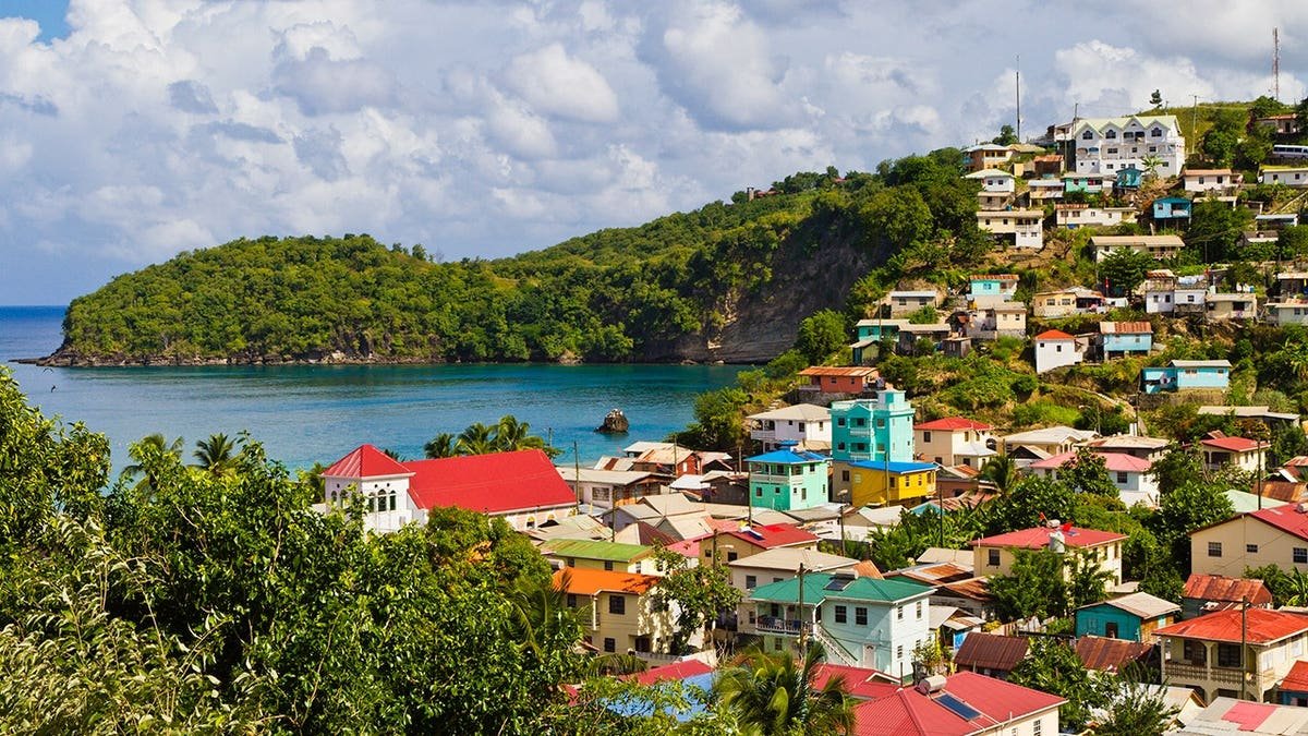 Colorful houses overlook a quiet bay in Canaries fishing village.