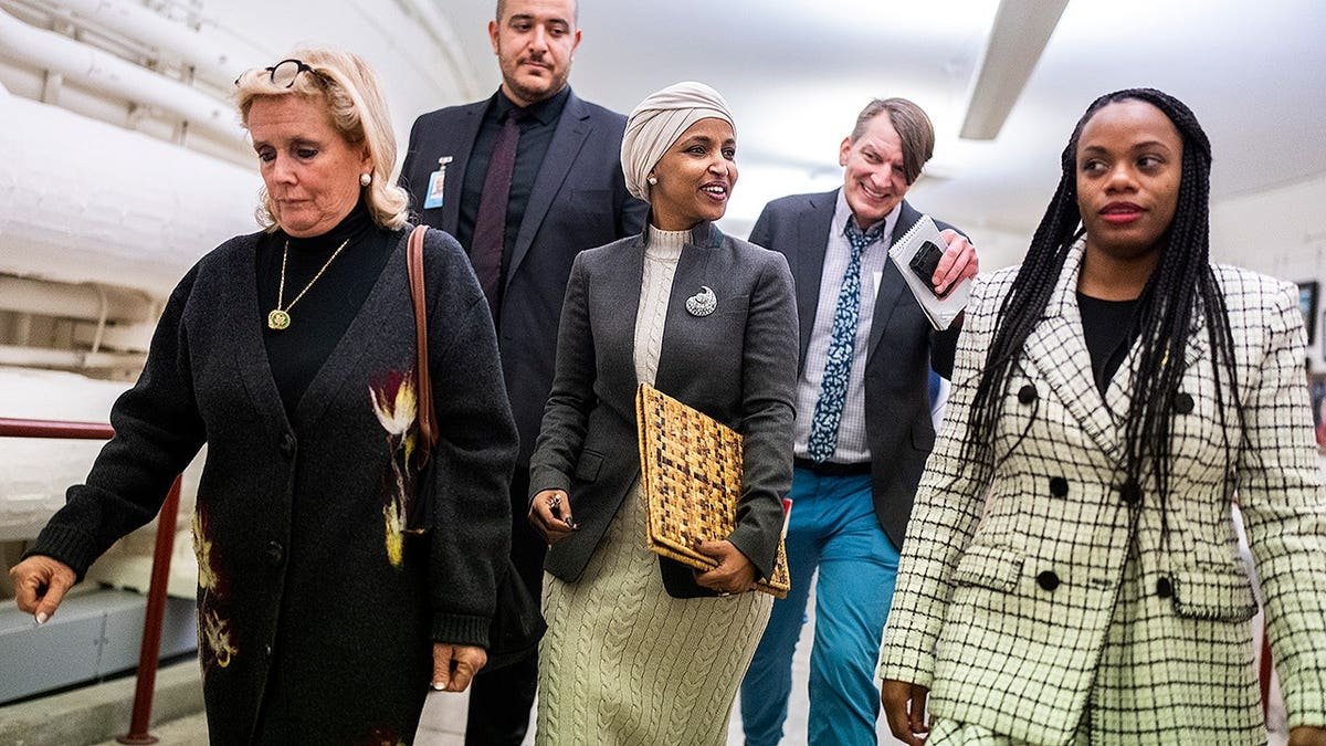 Summer lee and Ilhan Omar walk on Capitol Hill