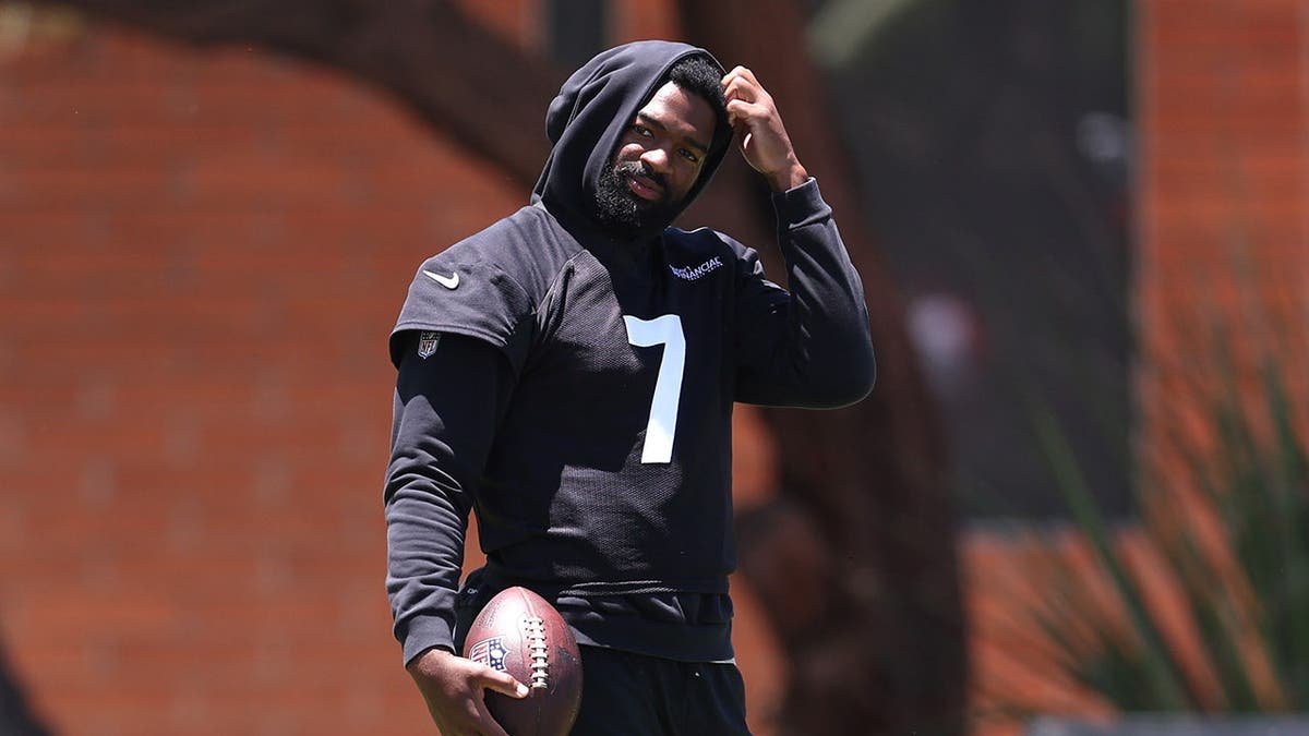 Jacoby Brissett #7 looks on during Arizona Cardinals mandatory minicamp.