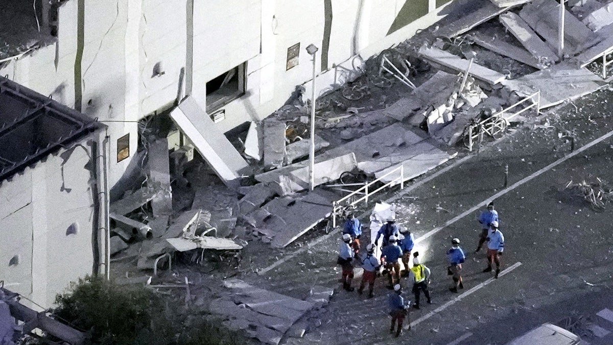 An aerial view shows rescue workers conducting a search and rescue operation at the damaged Aeon Mall shopping centre, where, according to local media, an explosion occurred after an earthquake with a preliminary magnitude of 7.1 struck Japan's southern Kumamoto prefecture, in Kashima Town, Kumamoto Prefecture, Japan, July 28, 2026. Kyodo/via REUTERS ATTENTION EDITORS - THIS IMAGE HAS BEEN SUPPLIED BY A THIRD PARTY. MANDATORY CREDIT. JAPAN OUT. NO COMMERCIAL OR EDITORIAL SALES IN JAPAN. TPX IMAGES OF THE DAY