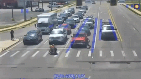 Good Samaritan in Spider-Man costume helps man in wheelchair cross busy intersection in viral moment