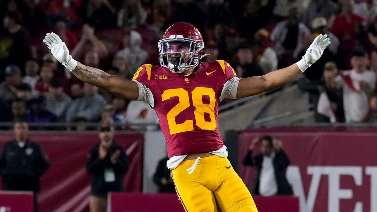Kennedy Urlacher #28 of the Southern California Trojans looks up at the crowd during a game.