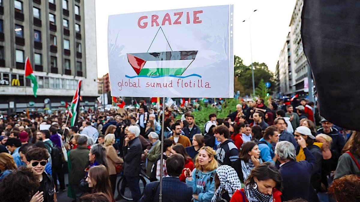 Demonstrators gather during a protest supporting the Global Sumud Flotilla in Milan.