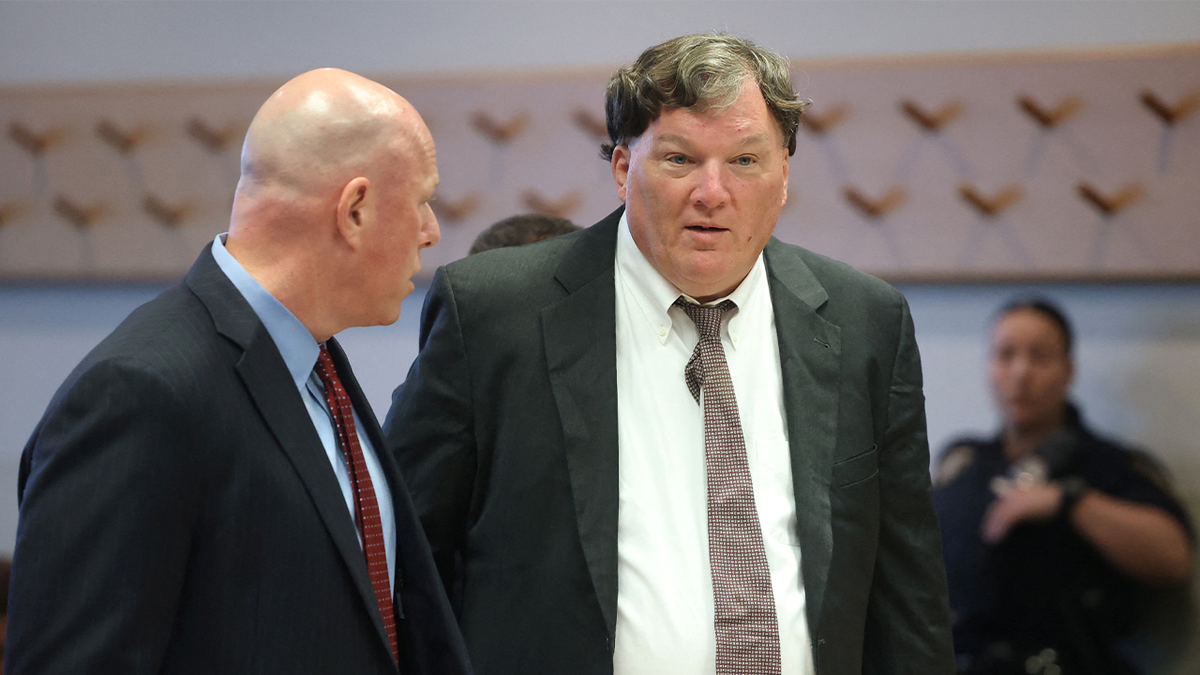 Michael Brown, left, and his client, Gilgo Beach suspect Rex Heuermann, in court