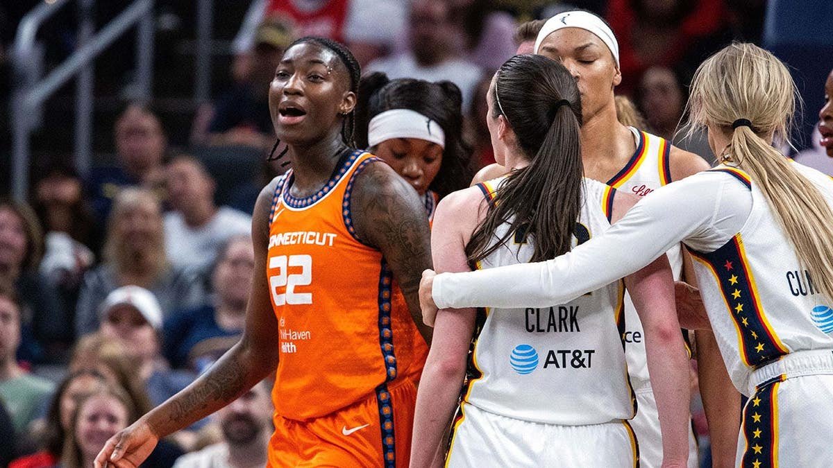Saniya Rivers and Caitlin Clark argue during a WNBA game at Gainbridge Fieldhouse.
