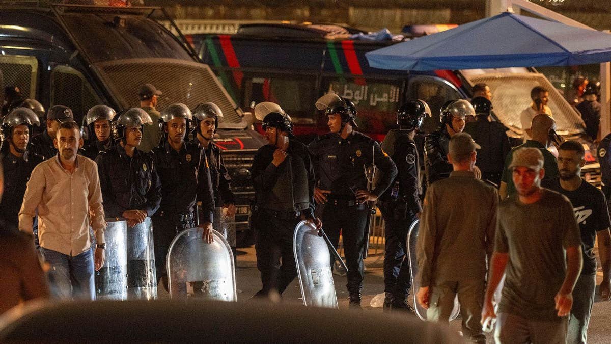 Security forces guard the border as migrants attempt to cross from Morocco into Spain's Ceuta enclave