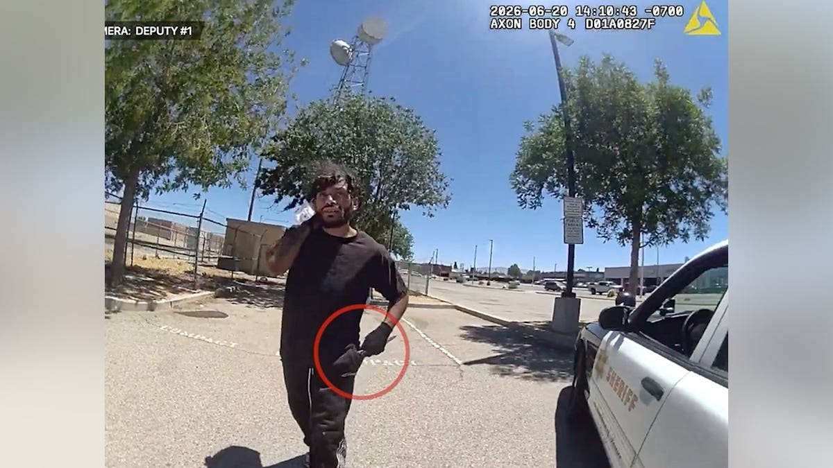 Body camera footage shows a man approaching a Los Angeles County sheriff's deputy while holding a knife in a Lancaster parking lot.