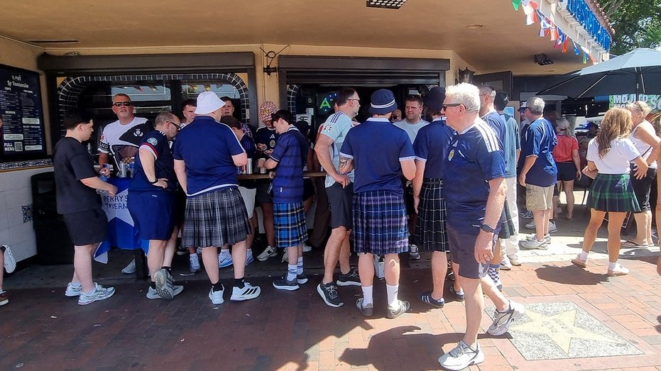 Scottish Tartan Army fans at a bar